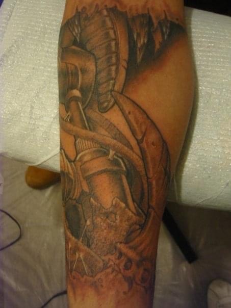 Biomechanical arm tattoo by Ghost
