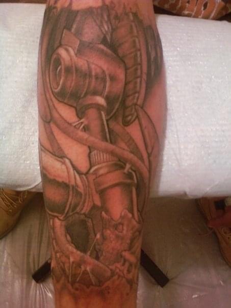 Biomechanical forearm tattoo by Ghost