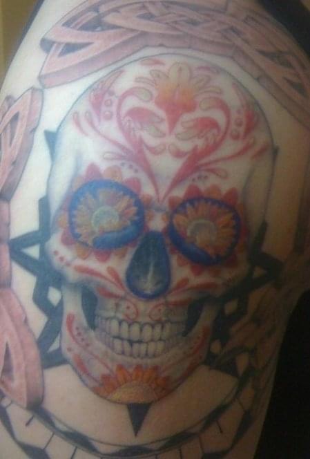 Colorful sugar skull tattoo by Ghost