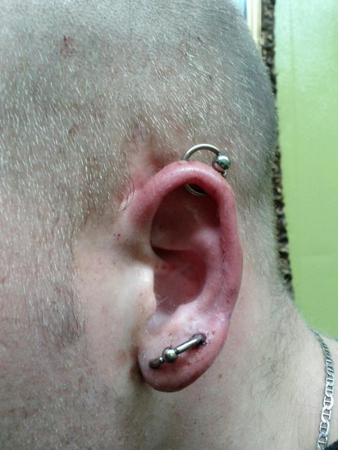 Rook and lobe barbell ear piercing